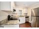 The kitchen features white cabinets and stainless steel appliances at 3435 Misty Valley Rd, Decatur, GA 30032