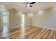 Bright bedroom featuring wood floors, ceiling fan and ensuite bathroom at 2436 Green Hollow Ct, Conyers, GA 30012