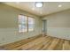 Dining room with hardwood floors and view of living room at 2436 Green Hollow Ct, Conyers, GA 30012