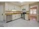 Modern kitchen featuring stainless steel appliances and granite countertops at 2436 Green Hollow Ct, Conyers, GA 30012