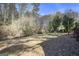 Spacious backyard featuring lush trees, a grassy lawn and an ample yard at 1471 Cedar Creek Ln, Riverdale, GA 30296