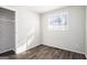 Sunlit bedroom with wood-look floors and closet at 1471 Cedar Creek Ln, Riverdale, GA 30296