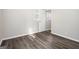Neutral bedroom with wood-look floors, closet and natural light at 1471 Cedar Creek Ln, Riverdale, GA 30296