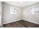 Comfortable bedroom with wood-look floors and window at 1471 Cedar Creek Ln, Riverdale, GA 30296