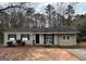 Charming one-story home with neutral siding, black shutters, and a well-maintained front yard at 1471 Cedar Creek Ln, Riverdale, GA 30296
