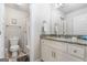 Clean bathroom with granite countertop, toilet, and shower/tub combo at 209 Enfield Ln, Mcdonough, GA 30252