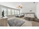 Main bedroom with two queen beds, large windows, and a ceiling fan at 209 Enfield Ln, Mcdonough, GA 30252