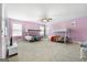 Bedroom with two bunk beds, ceiling fan, and light pink walls at 209 Enfield Ln, Mcdonough, GA 30252