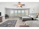 Main bedroom with two queen beds, large windows, and a ceiling fan at 209 Enfield Ln, Mcdonough, GA 30252