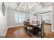 Formal dining room with hardwood floors and large window at 209 Enfield Ln, Mcdonough, GA 30252