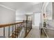 Upstairs hallway with view of staircase and bedroom at 209 Enfield Ln, Mcdonough, GA 30252