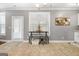 Kitchen breakfast area with glass top table and chairs at 209 Enfield Ln, Mcdonough, GA 30252