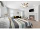 Main bedroom with fireplace, sitting area, and a ceiling fan at 209 Enfield Ln, Mcdonough, GA 30252