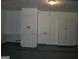 Garage with storage cabinets and door at 295 Adena W Ln, South Fulton, GA 30349