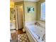 Bathroom with a jetted tub and view into another room at 52 Shadow Ct, Palmetto, GA 30268