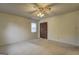 This cozy bedroom offers a ceiling fan, closet, and carpeted floor at 3954 Swathmore Ln, Duluth, GA 30096