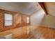 Bright bedroom features a vaulted ceiling and wood-paneled accent wall with large windows at 3954 Swathmore Ln, Duluth, GA 30096