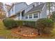 Well-maintained two-story house featuring a stone facade, white railings, and neat landscaping at 3954 Swathmore Ln, Duluth, GA 30096