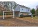 Two-story home featuring a covered carport and complemented by mature trees and landscaped surroundings at 3954 Swathmore Ln, Duluth, GA 30096