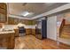 Well-lit kitchen with wood cabinets, stainless steel appliances, and hardwood floors at 3954 Swathmore Ln, Duluth, GA 30096