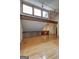 Spacious living room featuring hardwood floors, exposed beams, and windows at 3954 Swathmore Ln, Duluth, GA 30096