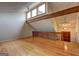 Open-concept living room with hardwood floors and natural light, featuring exposed beams and a staircase at 3954 Swathmore Ln, Duluth, GA 30096