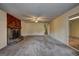 Spacious living room with a stone fireplace and neutral carpeting for a cozy feel at 3954 Swathmore Ln, Duluth, GA 30096