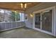 Inviting screened porch with sliding glass doors, perfect for enjoying the outdoors in comfort at 3954 Swathmore Ln, Duluth, GA 30096