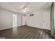 Bedroom with wood floors, ceiling fan, and mounted TV bracket at 65 Riverside Way, Sharpsburg, GA 30277