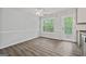 Bright dining area with backyard access, chair rails, and ample natural light at 65 Riverside Way, Sharpsburg, GA 30277