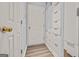 Hallway with built-in storage and access to a closet at 65 Riverside Way, Sharpsburg, GA 30277