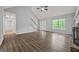 Bright living room features a fireplace, vaulted ceiling, and new flooring with backyard access at 65 Riverside Way, Sharpsburg, GA 30277