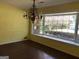 Dining room showcasing hardwood floors, chandelier, and a large bay window view at 138 Le Brun Ne Rd, Atlanta, GA 30342