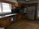 Kitchen featuring wood cabinets, stainless steel appliances, and ample counter space at 138 Le Brun Ne Rd, Atlanta, GA 30342