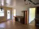 Living room featuring hardwood floors, backyard access, built-in shelves, and desk space at 138 Le Brun Ne Rd, Atlanta, GA 30342