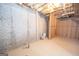 Unfinished basement with exposed pipes and brick walls at 568 Martin Mill Rd, Moreland, GA 30259