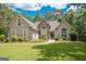 One-story house with stone accents and landscaped lawn at 568 Martin Mill Rd, Moreland, GA 30259