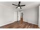 Spacious bedroom with wood floors and ceiling fan at 2160 Robin Hood Trl, Cumming, GA 30040