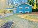 Charming blue two-story home with a carport and well-maintained front lawn at 2803 Norgate Ln, Decatur, GA 30034