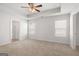 Spacious bedroom with carpet, ceiling fan, and en-suite bathroom at 11996 Conrad Cir # 128, Hampton, GA 30228