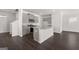 Modern kitchen with gray cabinets, granite countertops, and island at 11996 Conrad Cir # 128, Hampton, GA 30228