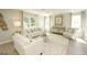 Bright living room with comfy sofas, large windows, and a stylish rug at 11996 Conrad Cir # 128, Hampton, GA 30228