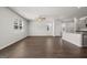 Spacious living area featuring hardwood floors and a neutral color palette at 11996 Conrad Cir # 128, Hampton, GA 30228
