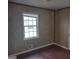 Bedroom with wood paneled walls and wood flooring at 2709 Somerton Dr, Morrow, GA 30260