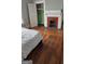 Bedroom with hardwood floors and a fireplace at 1786 Lakewood Se Ave, Atlanta, GA 30315