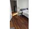 Bedroom with hardwood floors and a nightstand at 1786 Lakewood Se Ave, Atlanta, GA 30315