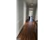 Long hallway with hardwood floors leading to other rooms at 1786 Lakewood Se Ave, Atlanta, GA 30315