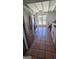 Open kitchen with stainless steel appliances and terracotta tile floor at 1786 Lakewood Se Ave, Atlanta, GA 30315