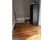 Small room with hardwood floors and shelving unit at 1786 Lakewood Se Ave, Atlanta, GA 30315