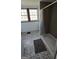 Bathroom featuring a tile shower, patterned floor tiles, and a window at 1839 Lakewood Se Ave, Atlanta, GA 30315